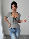 Ninonine "Amara" | Contrast Trim Bow-Front Knit Top